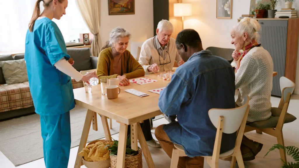 Nursing home residents enjoying a card game