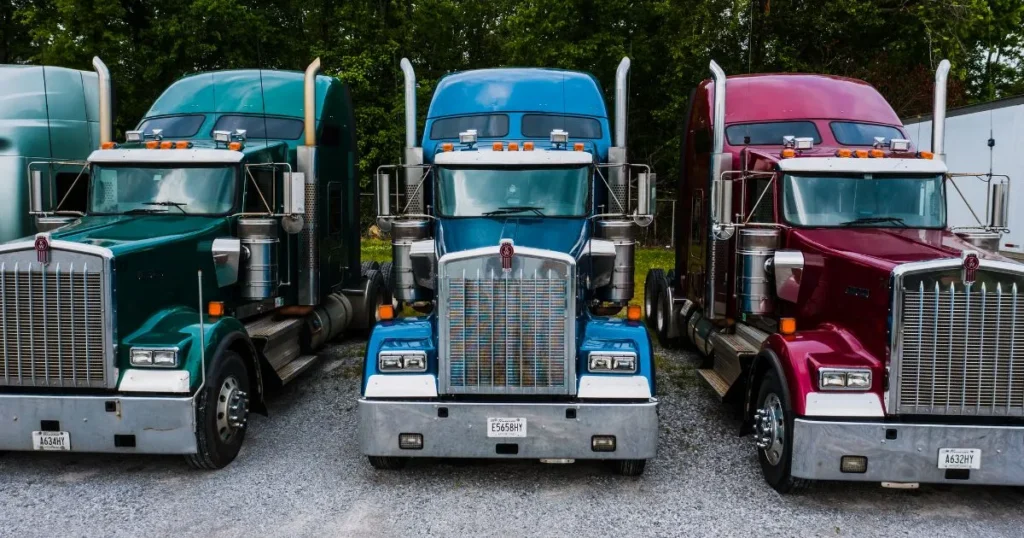 3 parked 18-wheeler trucks