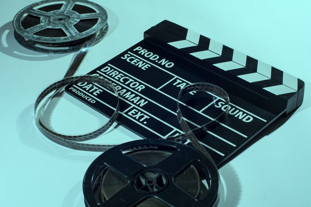 Two reels of film with a clap movie