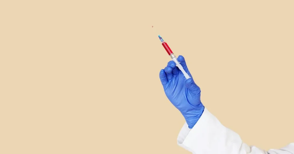 Doctor holding a shot