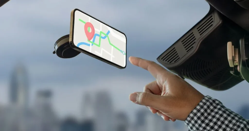 Person interacting with their vehicles GPS system.
