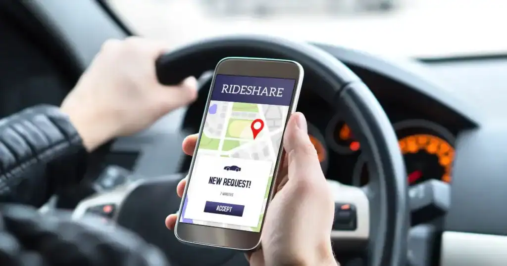 Rideshare app on smartphone showing pickup location and request button.