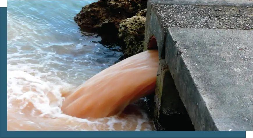 Water flowing from pipe into ocean, environmental impact.