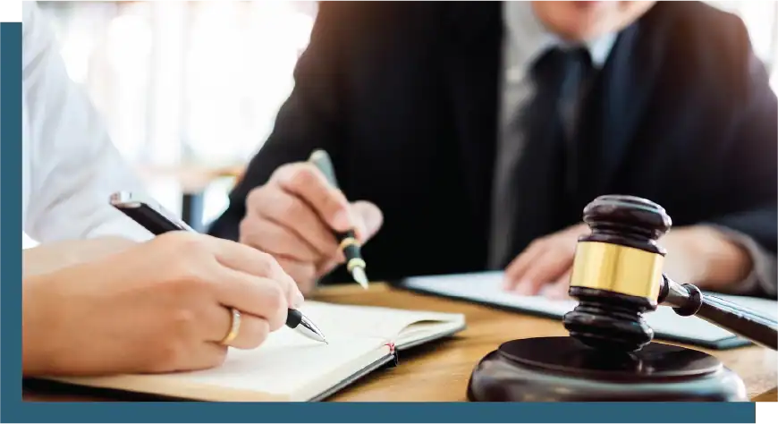 Business meeting with legal advisor, gavel, and notepad at RPWB law firm.