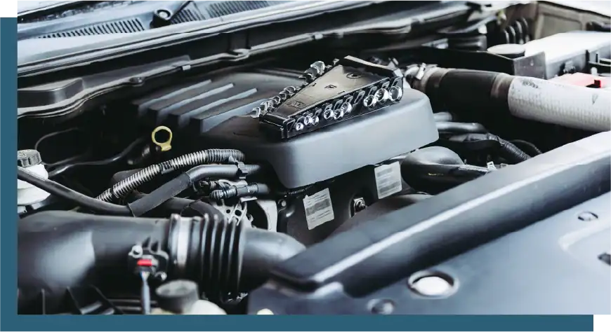 Engine bay with detailed view of engine components and mechanical parts.